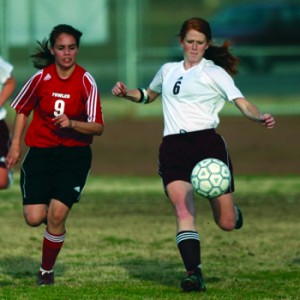 Girls playing football